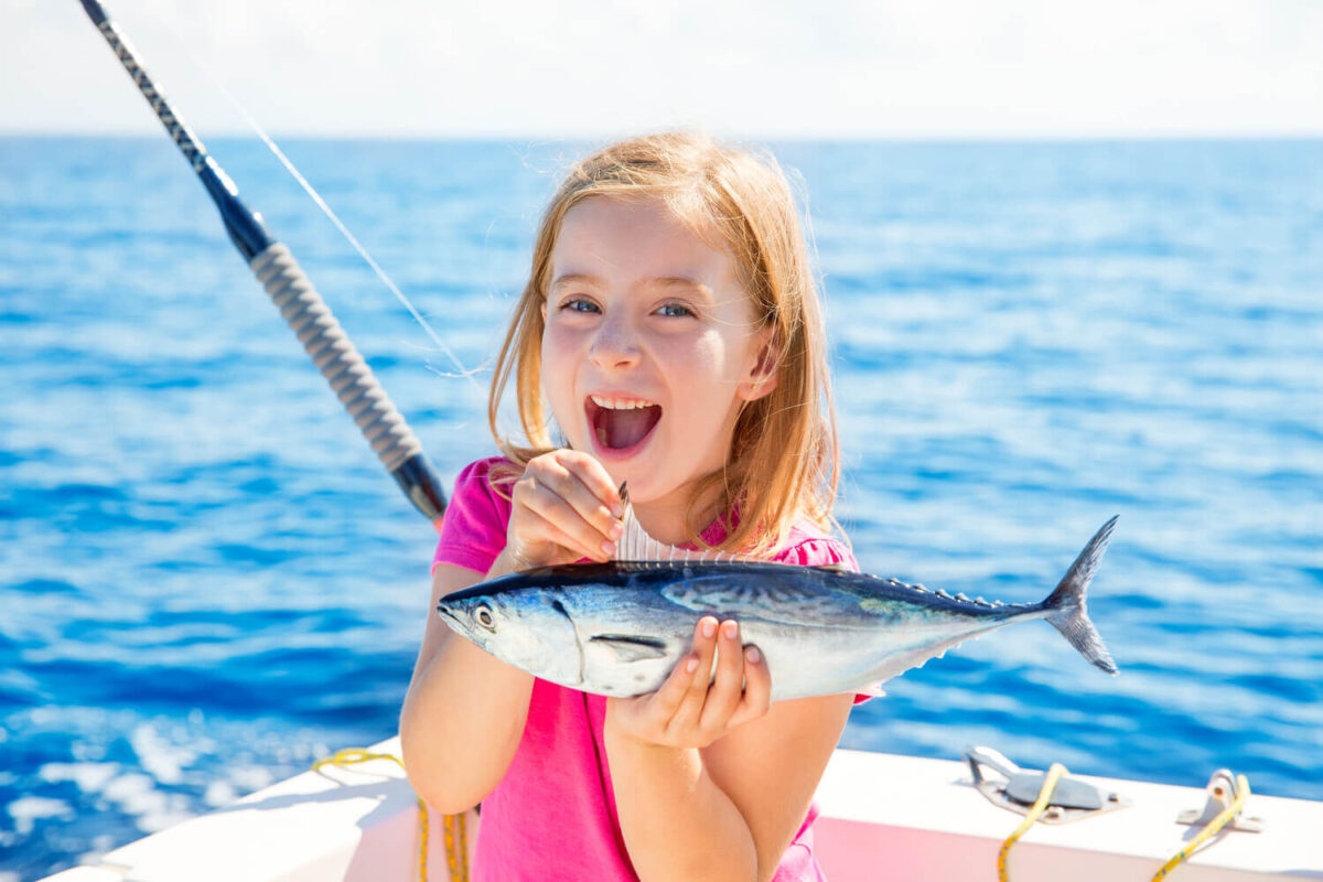Picture of a girl enjoying a Marco Island fishing charter.