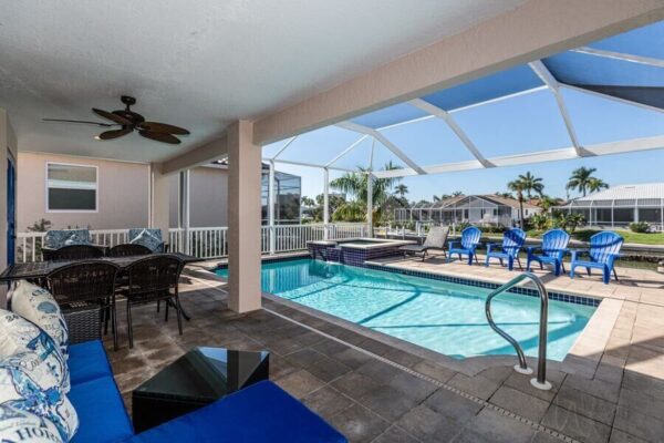 The outdoor living space at a Marco Island vacation rental to relax in after parasailing.