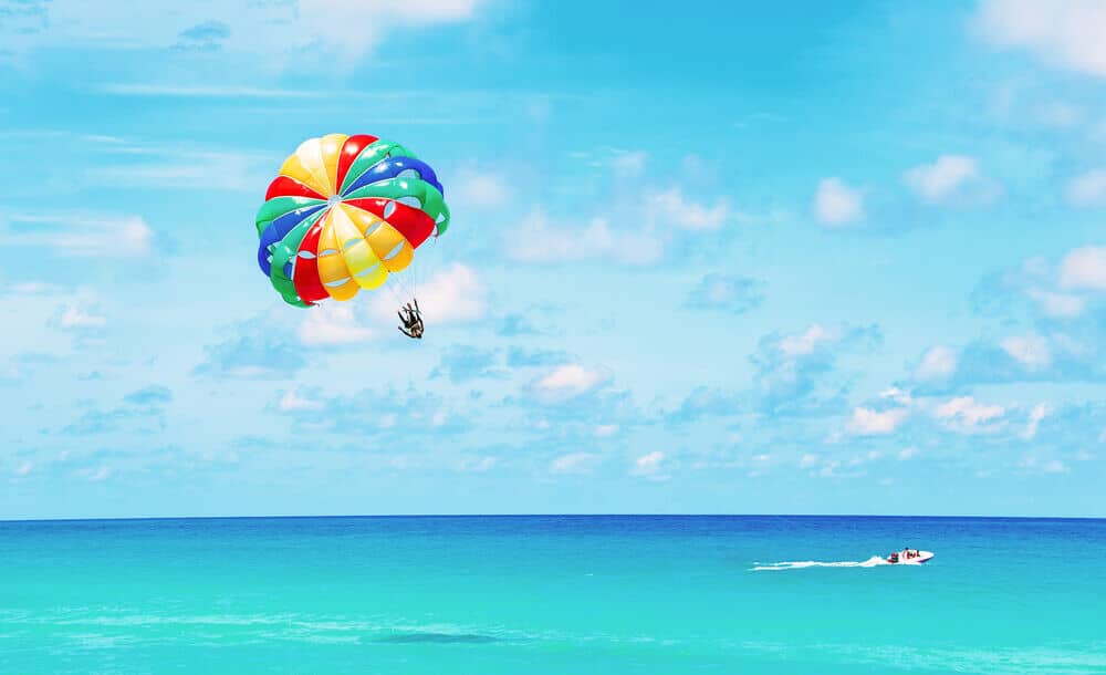 A person parasailing over Marco Island waters.