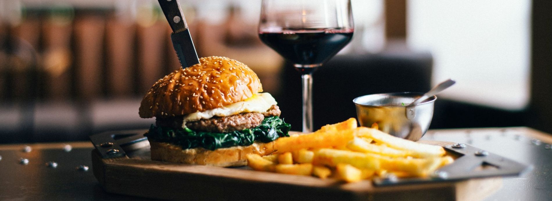 burger with fries and red wine